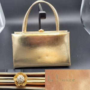 Vintage gold lame purse with sparly goldtone and rhinestone clasp, La France